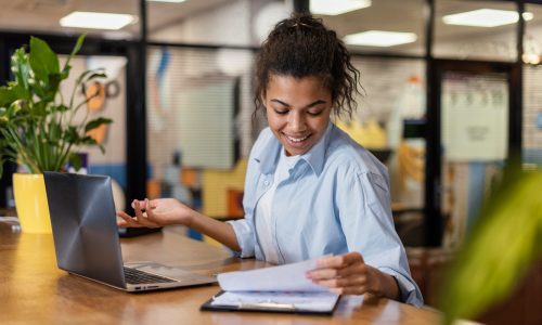 Office worker at desk and notebook